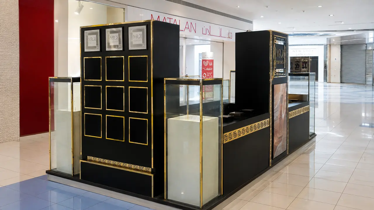 Custom black and gold perfume kiosk by Creative Point LLC